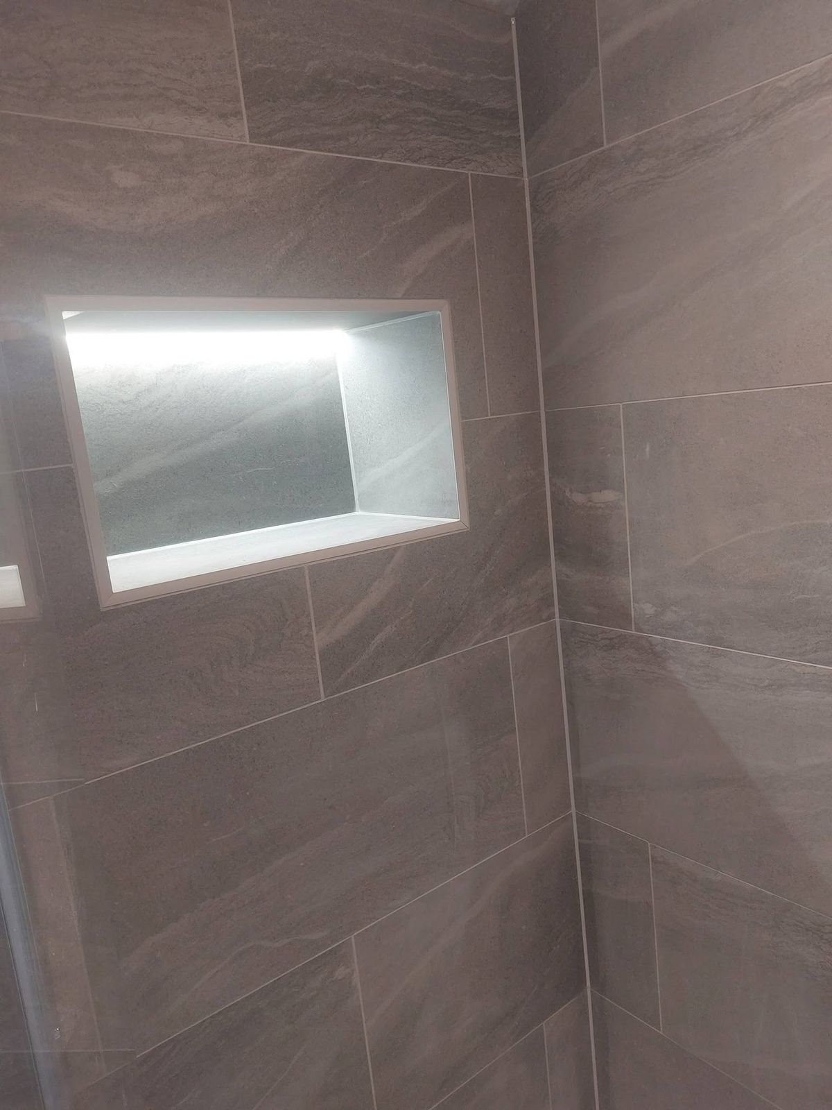 Close-up of LED-lit shower niche