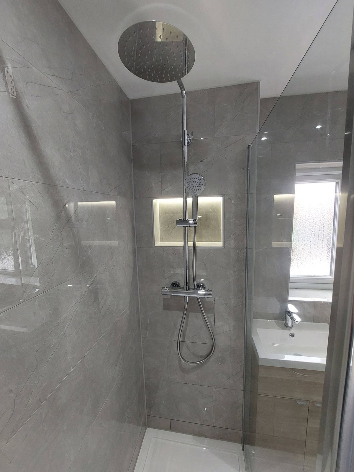 Rainfall shower with lit niche